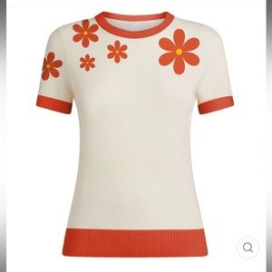 Vintage-inspired, stylish knit top; white with orange details. Unworn with tags.
